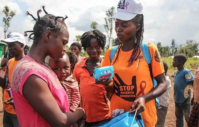 Women receiving menstrual health supplies. 