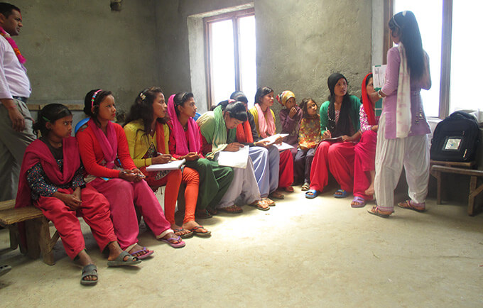 Girls learning about menstrual health.