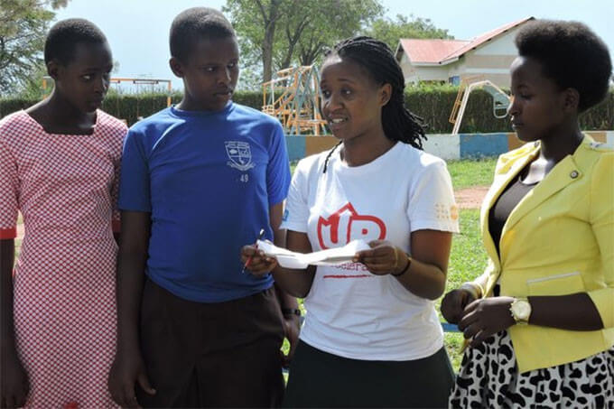 Girls talking about the reusable pad they created.