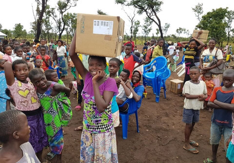 Woman with menstrual health supplies. 