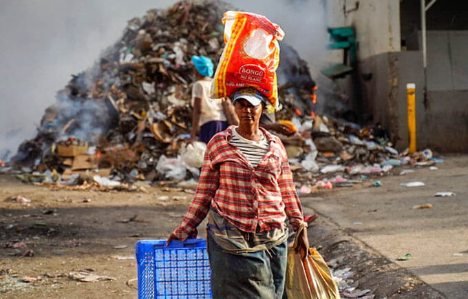 A woman walks in streets left empty by a general strike in Port-au-Prince, Haiti. © RICHARD PIERRIN/AFP via Getty Images