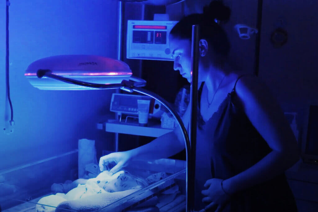 A mother cares for her baby in an underground bunker during air raids in Ukraine