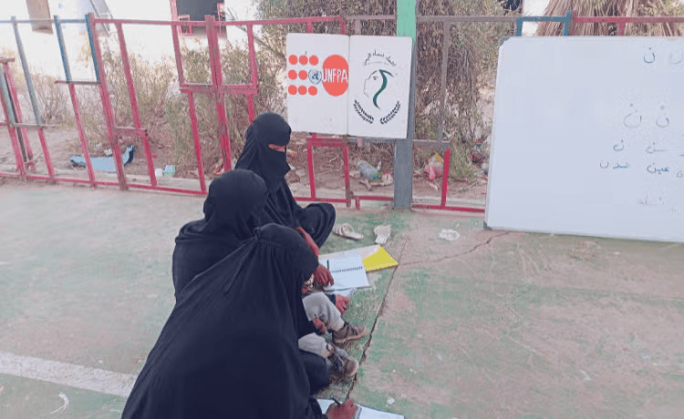 Women attend a literacy class at a UNFPA safe space in Yemen